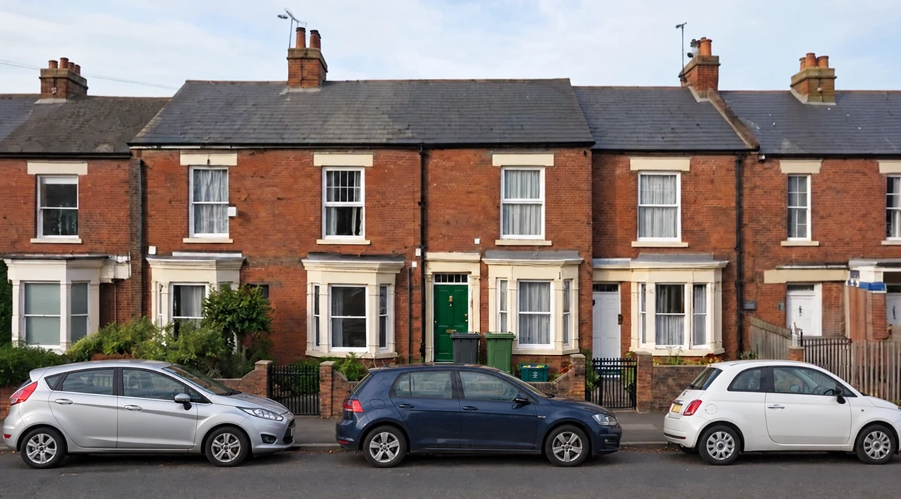 Brick frontage before: parked cars and bins visible